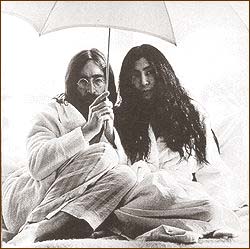 John Lennon holds an umbrella during the Amsterdam Bed-In For Peace.