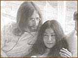 John cuddles with Yoko