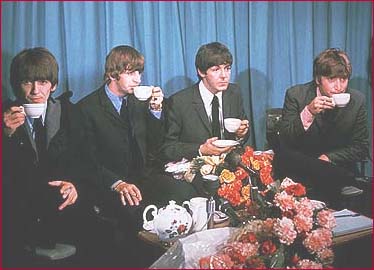 Tea-sipping Beatles in 1964.