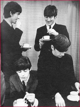 The Beatles enjoy their tea.