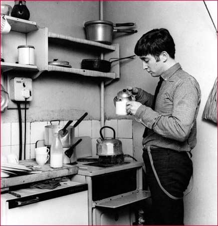 John Lennon makes a cup of tea, circa 1963.