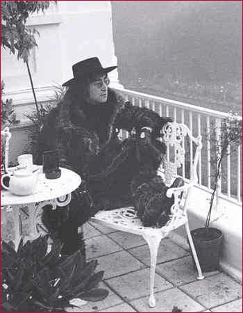 John Lennon has tea at his home, Tittenhurst, in England.