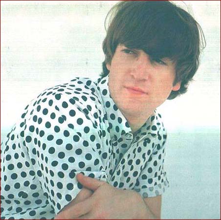 1: The Sensitive Type: Here John Lennon wears a trendy (at the time!) basic white shirt with black polka dots. This photos comes from a photo shoot that took place at John’s home in Kenwood.