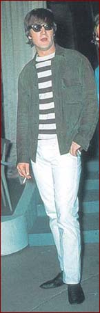 9: Hanging Out Stripes: This photo of John Lennon was taken backstage at a concert venue during the Beatles’ American summer tour of 1965. Here John is wearing casual white pants, a striped knit shirt and a sporty jacket (and his trademark Beatle black boots).